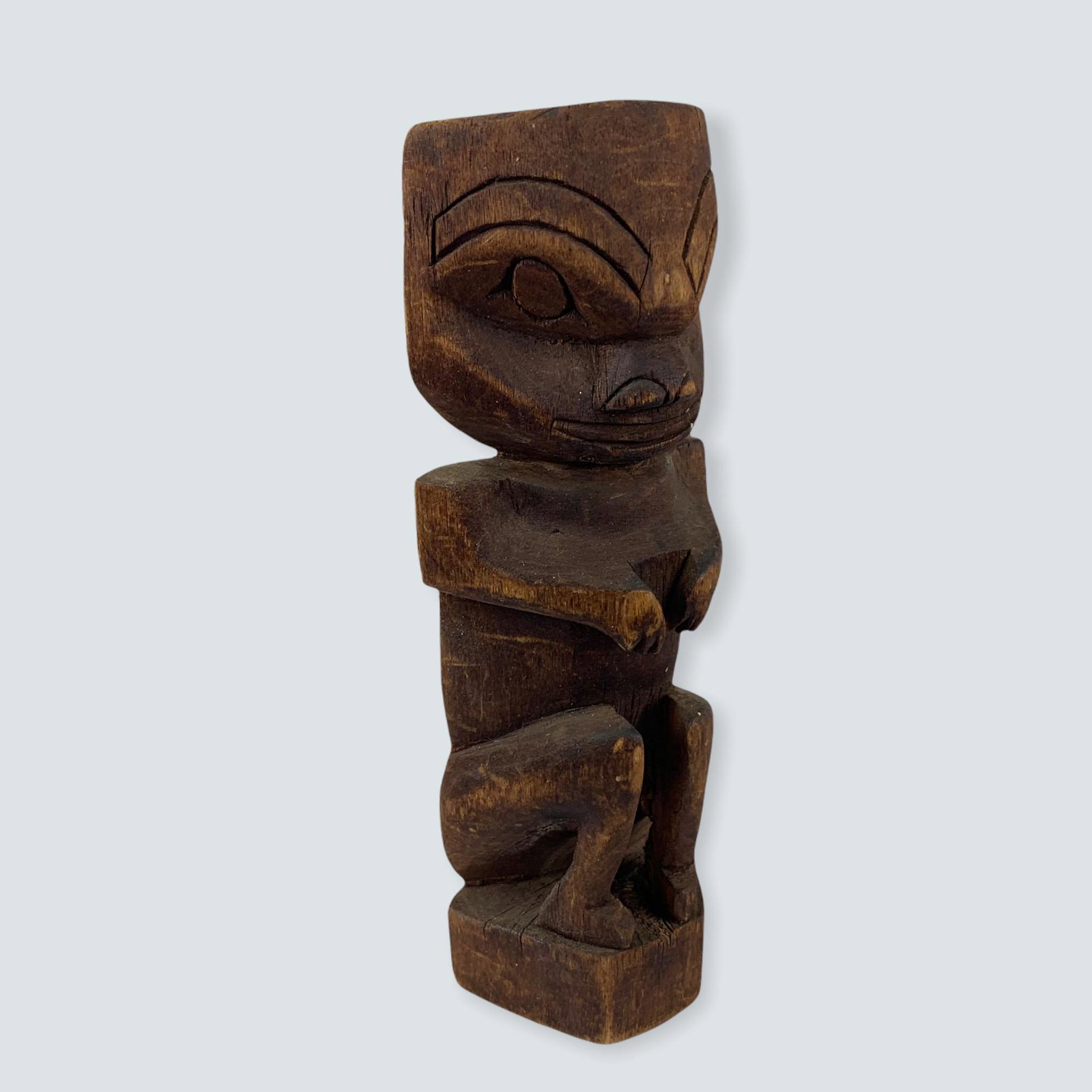 Small Unsigned Carved Totem: A small 6 1/2 carved totem pole with scooped out back and nice early patina.