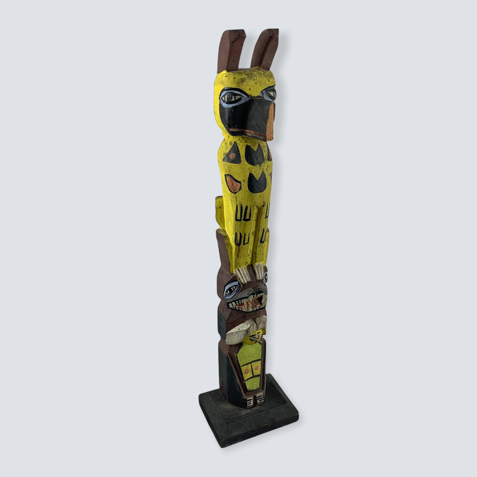 Carved Totem, Good Older Paint: A earlier totem with good older colors in paint. 12 1/2 â€œ. Missing wings and chip to nose