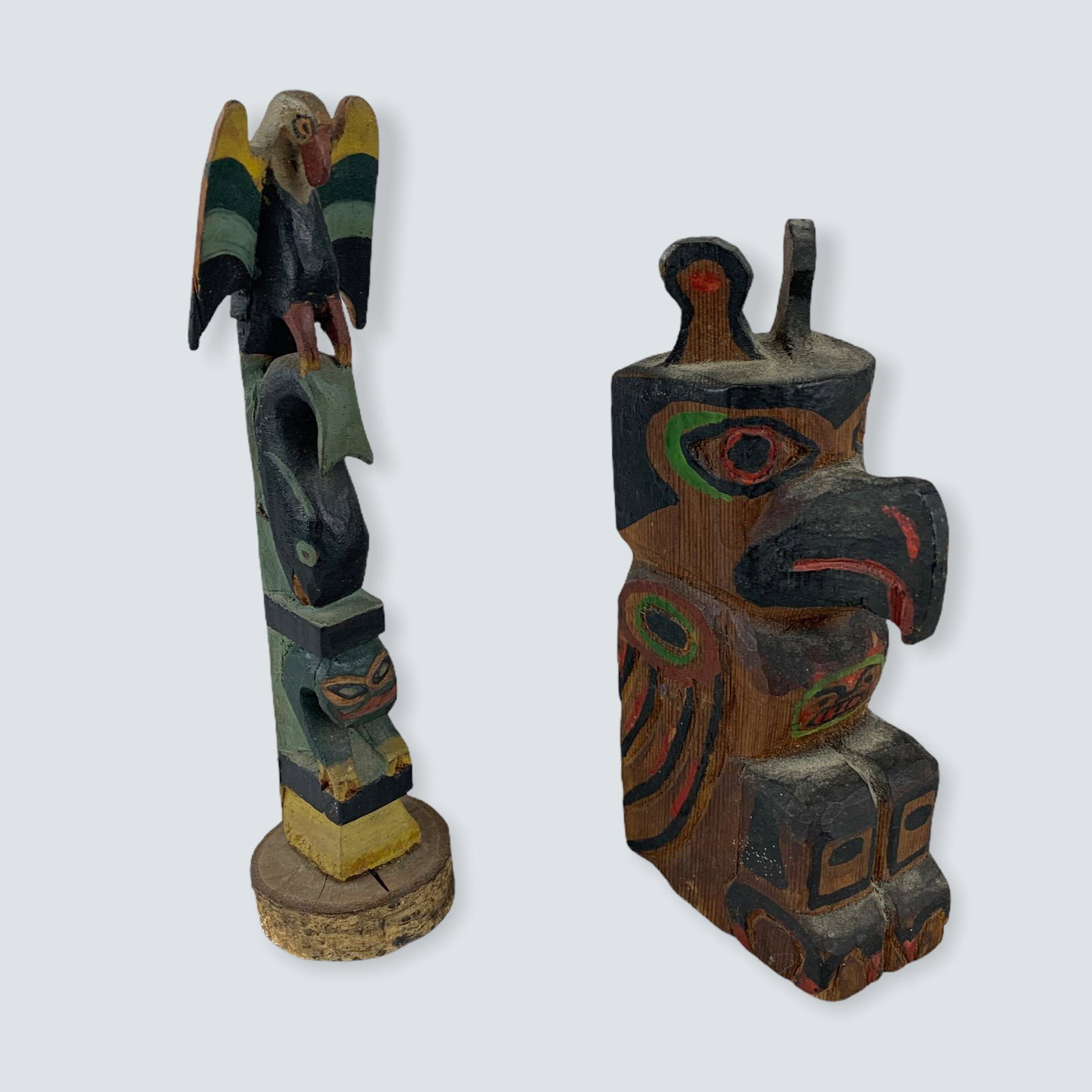 2 Small Carved Totems: A pair of earlier small carved totem poles, 6 1/2 and 5 1/4., nice older ones