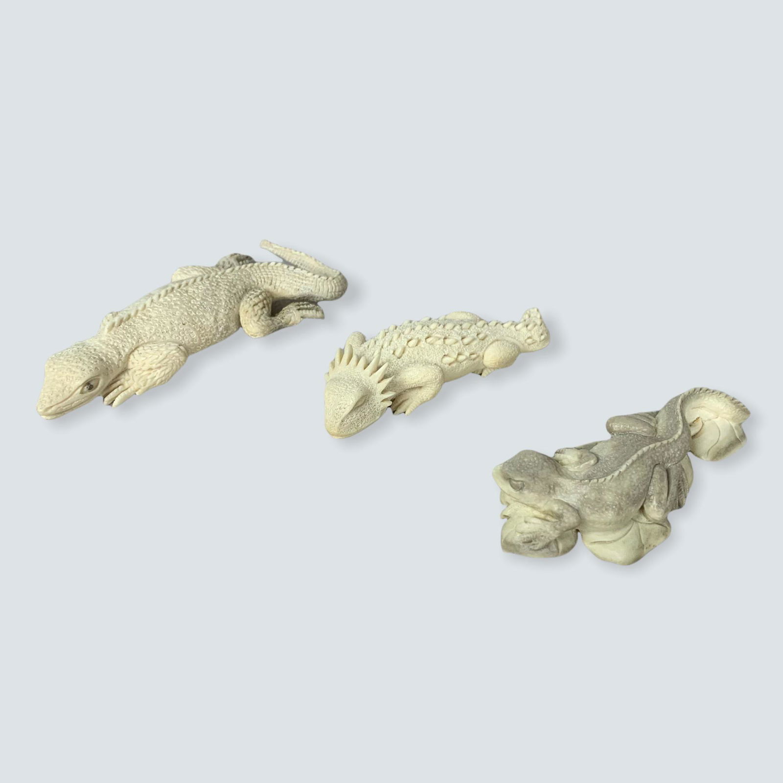 3 Fine Caribou Horn Carvings: Collection of 3 fine hand carved lizards made from Caribou horn. 3 x 3 1/2.