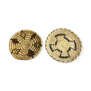 Pair of Miniature Hopi Coiled Plaques/Trays: A pair of small Hopi coiled basket trays. Each measuring between 5 to 6 inches in diameter.