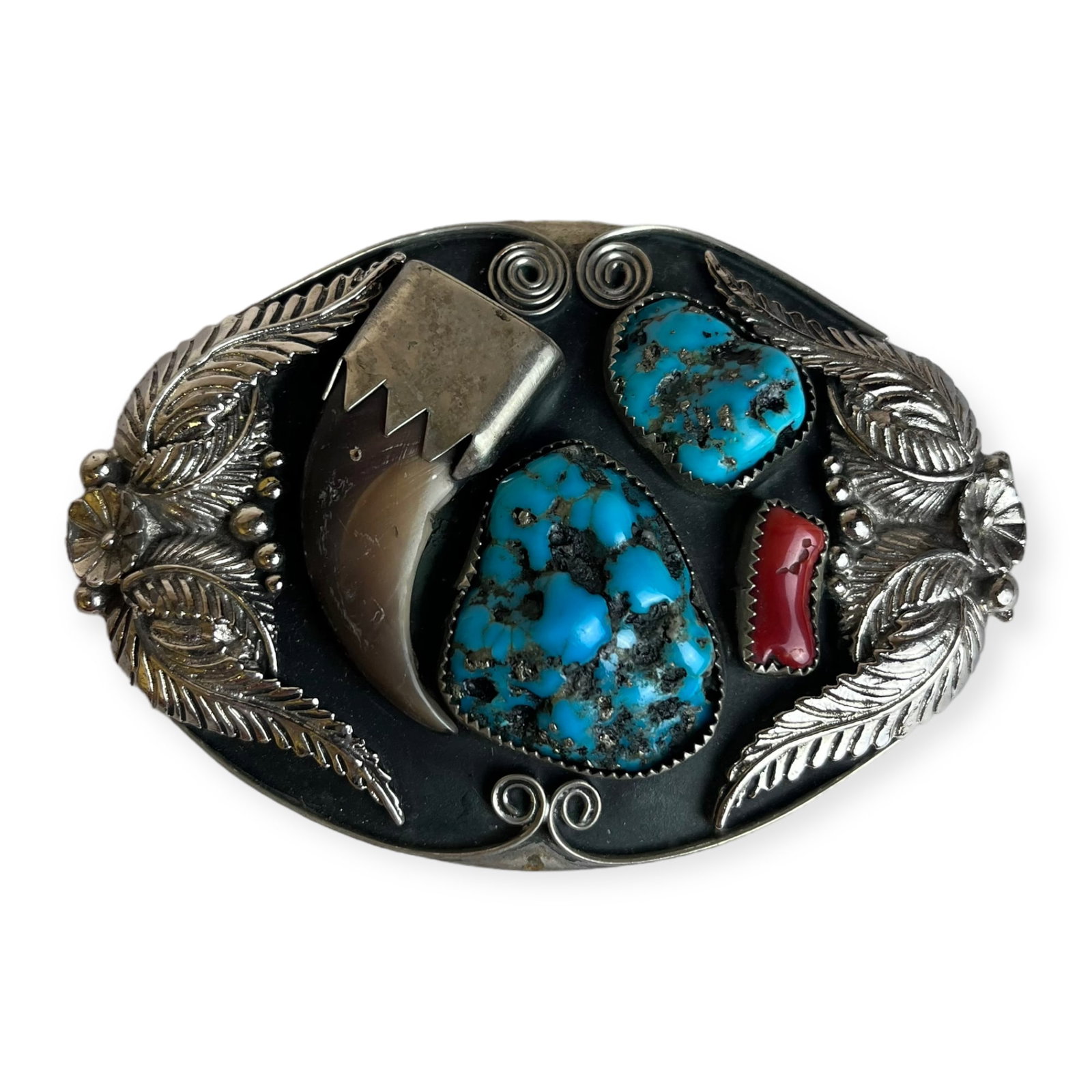 Navajo Bear Claw Belt Buckle: A silver belt buckle with turquoise stones, and in laid bear claw. The buckle is unmarked. Measures approx 3 3/4 x 2 1/2 inches.