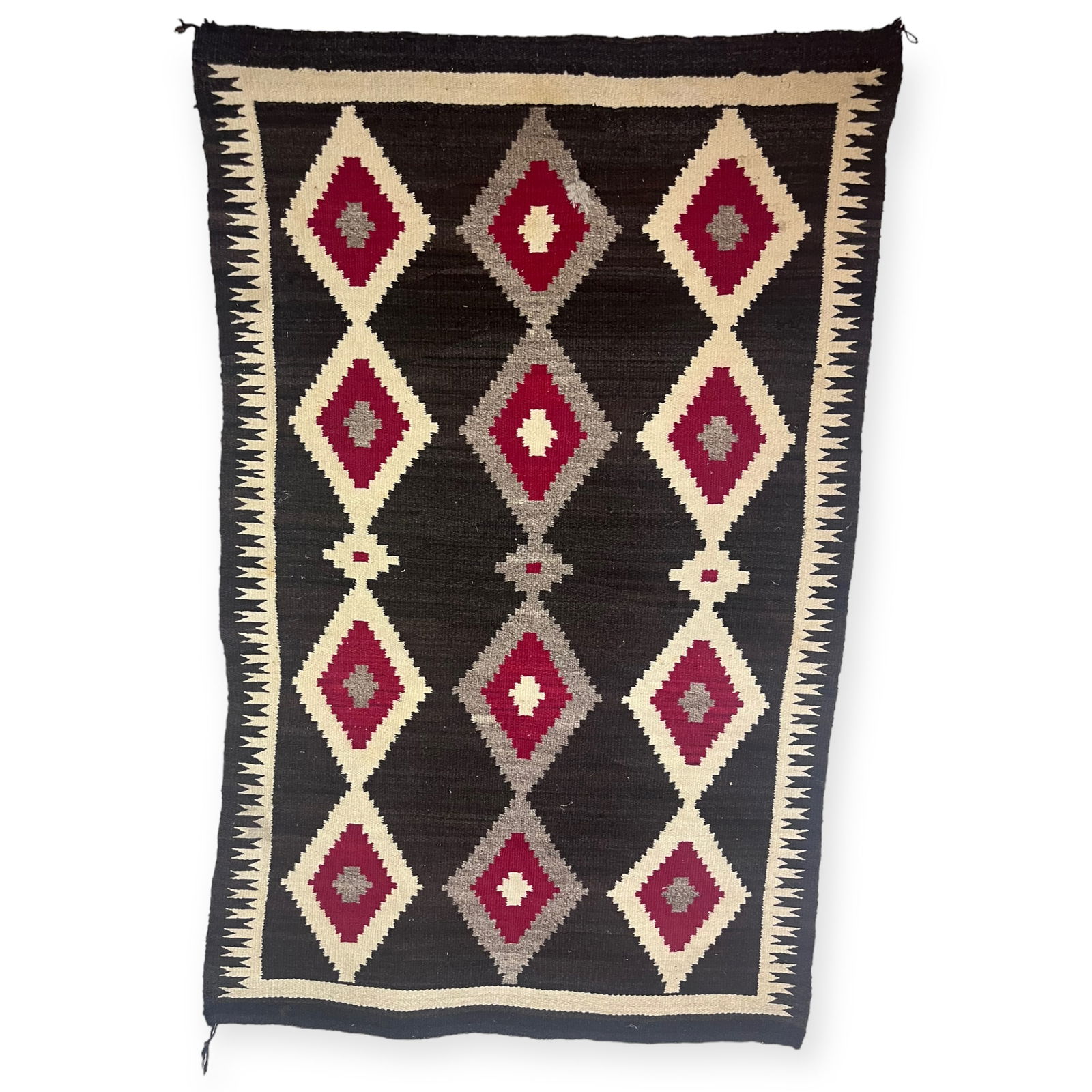 Early Navajo Dark Tone Rug: Measures approx 48 x 70 inches. 1910-30. Good with one small 1 x 1 inch repair.