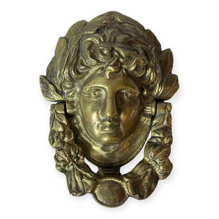 Brass Door Knocker: Heavy and well cast brass door knocker.