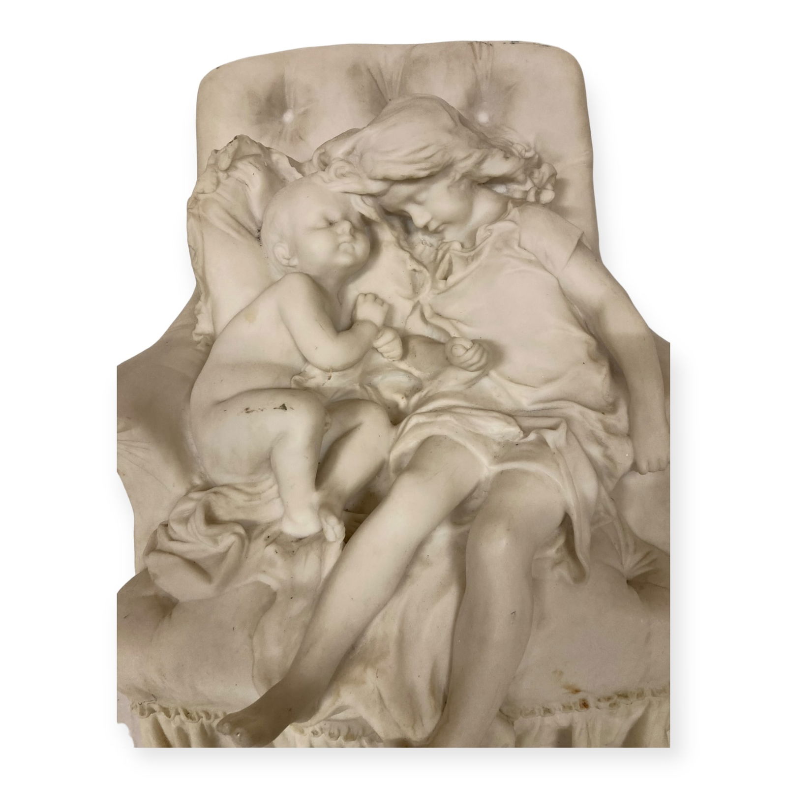 Carved girl and baby in armchair: Very nice alabaster figurine of child and baby seated in cushion arm chair. Very detailed and in excellent condition