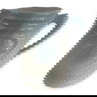 Blue & White Stoneware Indian Head Pitcher: Vintage Blue & White stoneware crockery Indian head pitcher with basket weave background. 8 inches. One chip at lip and one very small nick on inside rim.