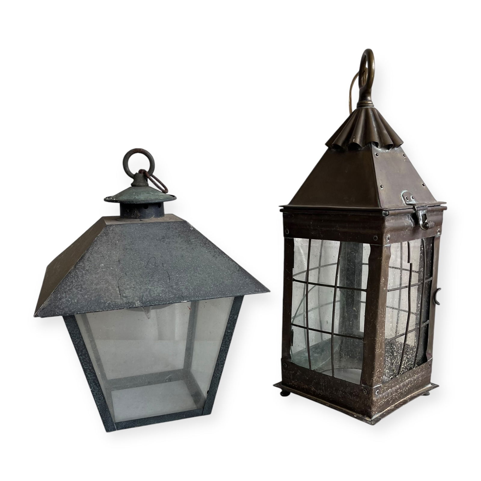 Pair of Early Lanterns: Glass and pressed metal. Measuring approx 17 x 5.5 x 5.5 inches.