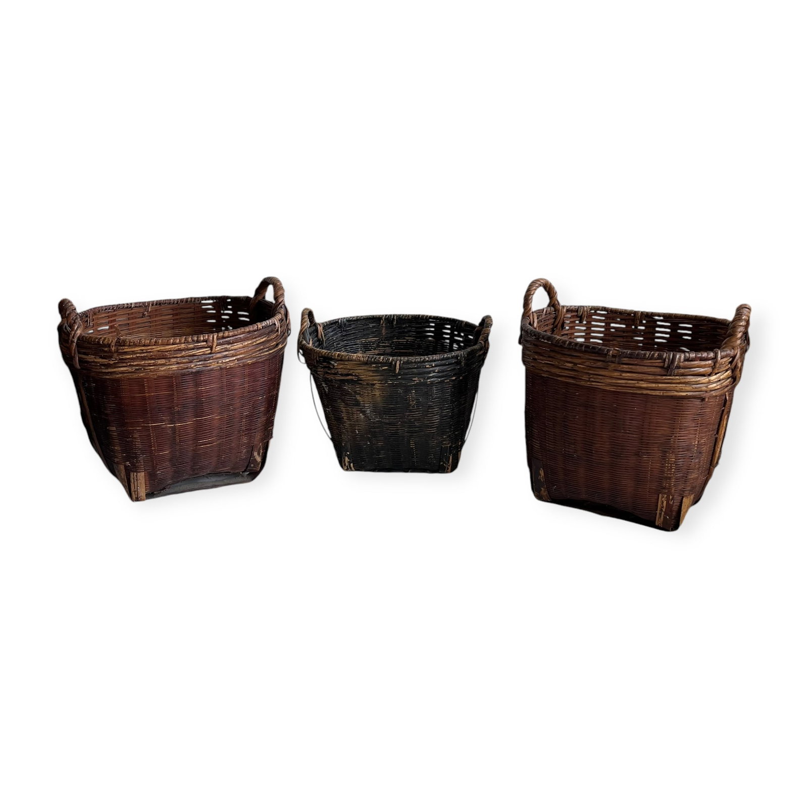 Grouping of 3 Vintage Baskets: Two matching baskets measuring approx 11 x 11 x 11 inches. Some damage, loss.
