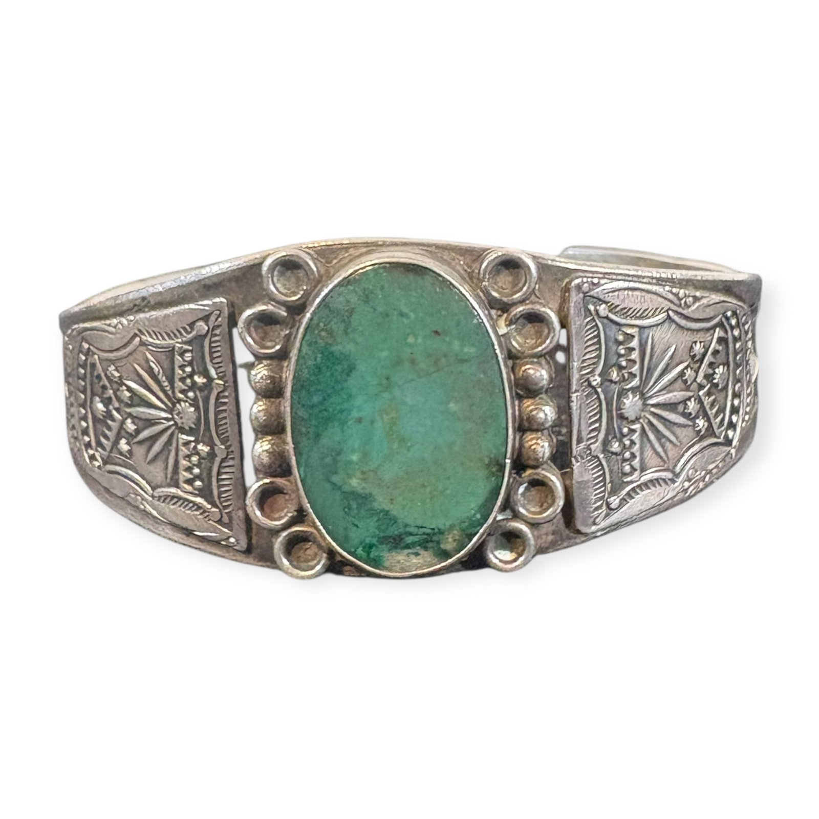 Fred Harvey Era Stamp Work Navajo Bracelet: Large stone at center, creation condition. Measures approx 2.5 inches across at widest point.