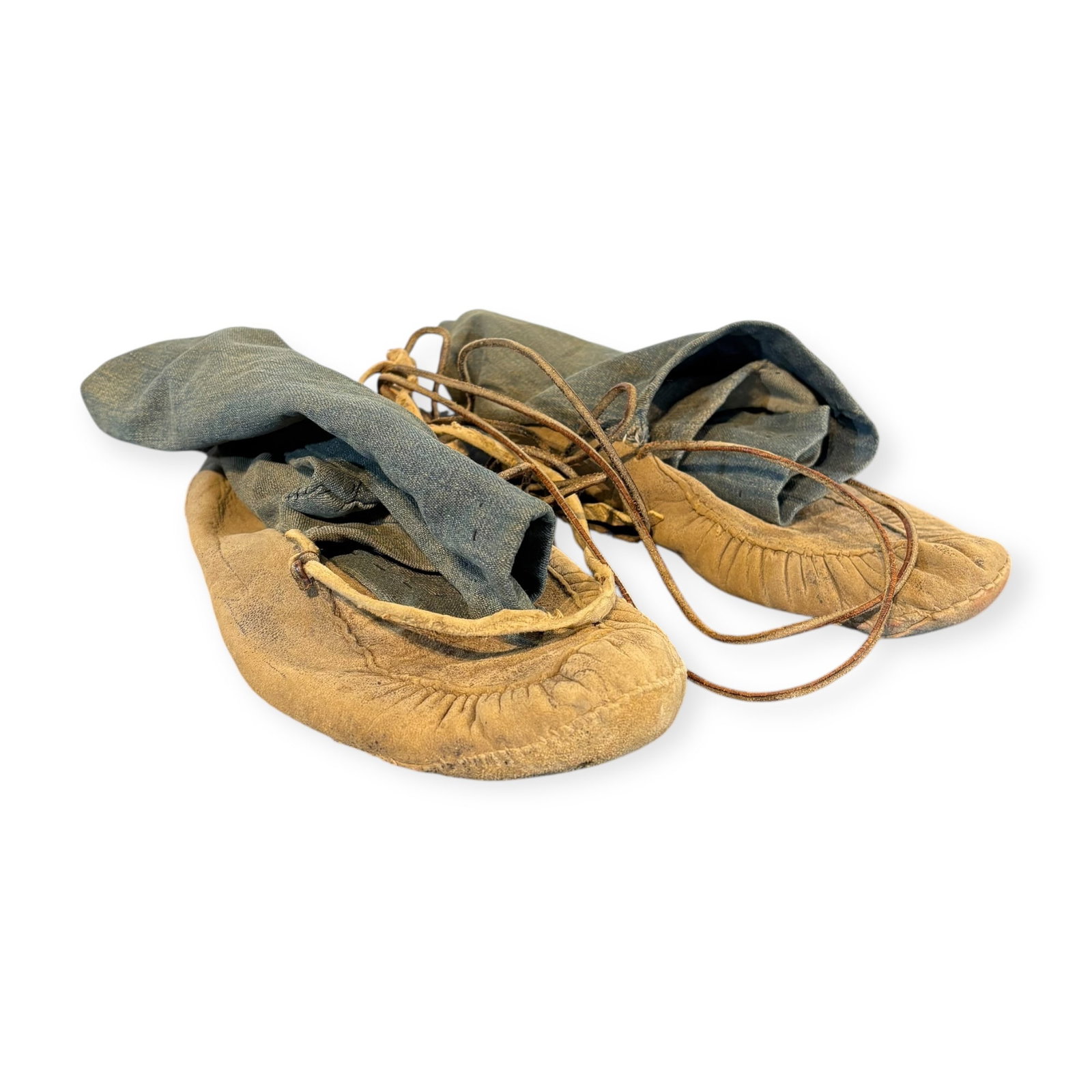Ojibwa Wild Rice Moccasins: Adult sized, measuring 10.5 inches in length. Patches to sides with blue denim added to the tops. Circa 1900.
