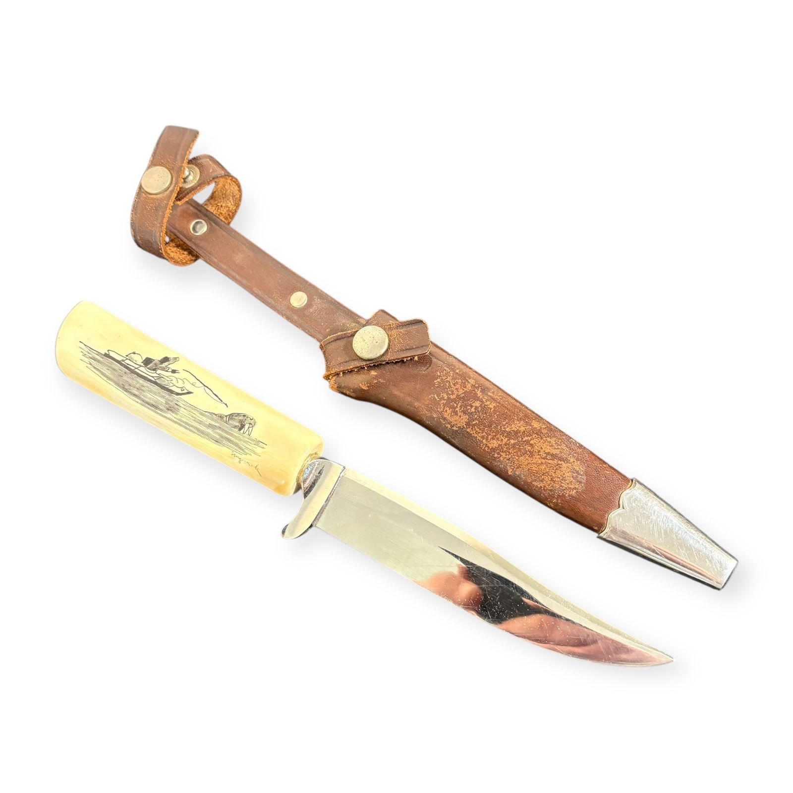 Scrimshawed Knife - Signed Solingen Rostere, Germany: Measuring approx 9 inches in length, bone handled and scrimshawed knife with leather scabbard. 20th century.