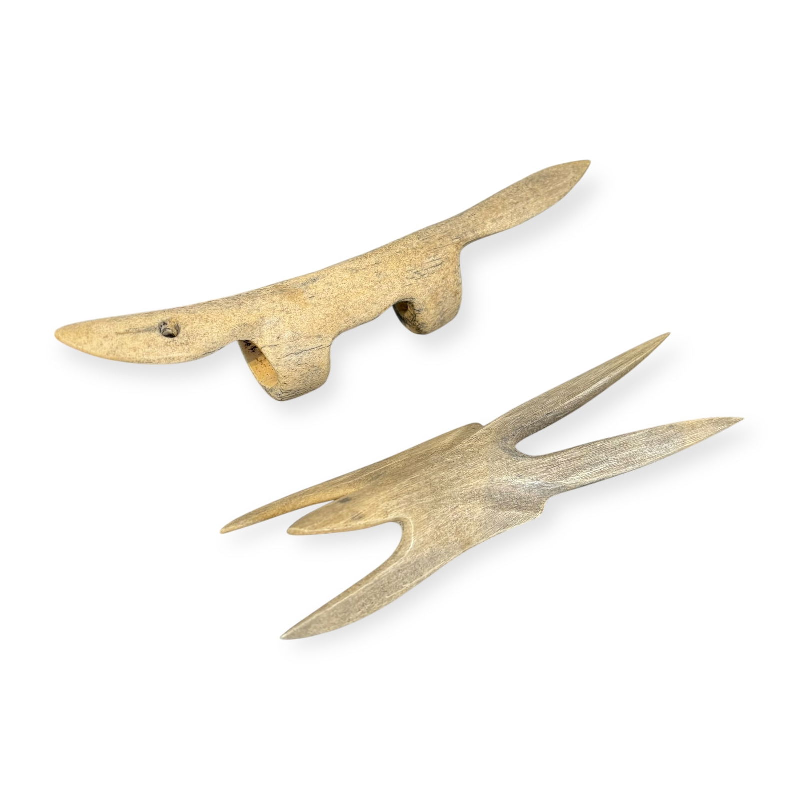 2 Alaskan Bone Fishing Line Spools: Hard to find pair of Alaskan bone fishing line spools. Animal forms. 8 inch and 6 1/2 inch. No damage