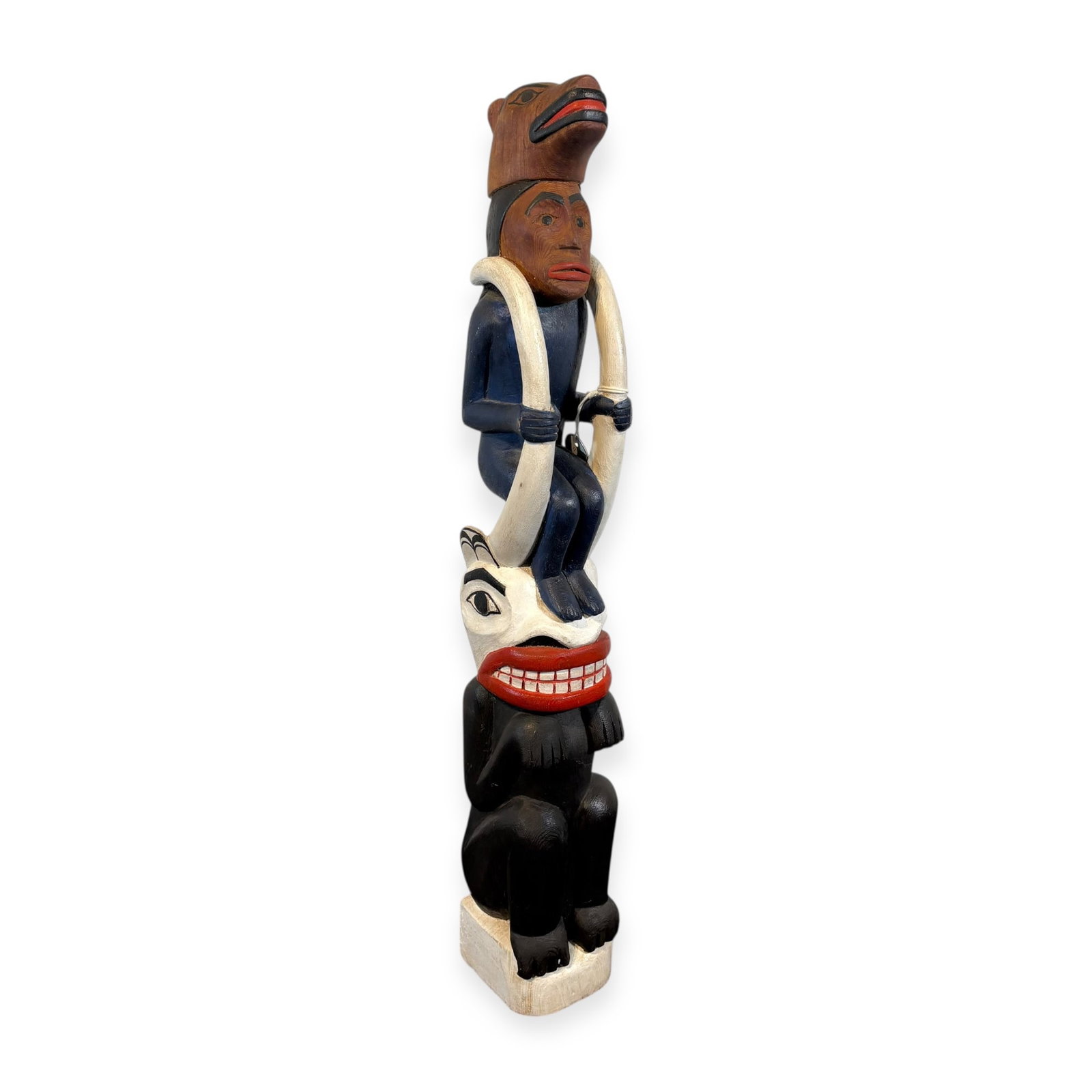 Bella Colla Totem Pole: Measuring approx 24 inches tall, featuring a man atop a a figure with a bear head top. Great detailed carvings, circa 1930-1950.