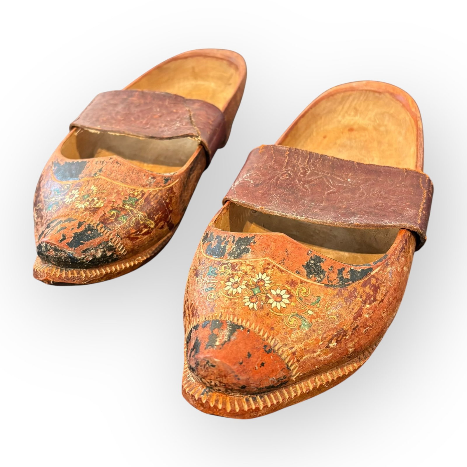 Pair Of Antique Scandinavian Rosemaling Wood Shoes: Pair of antique scandinavian wood shoes. Original worn rose mauled paint with designed leather straps. 11 1/2 inches long. Excellent condition
