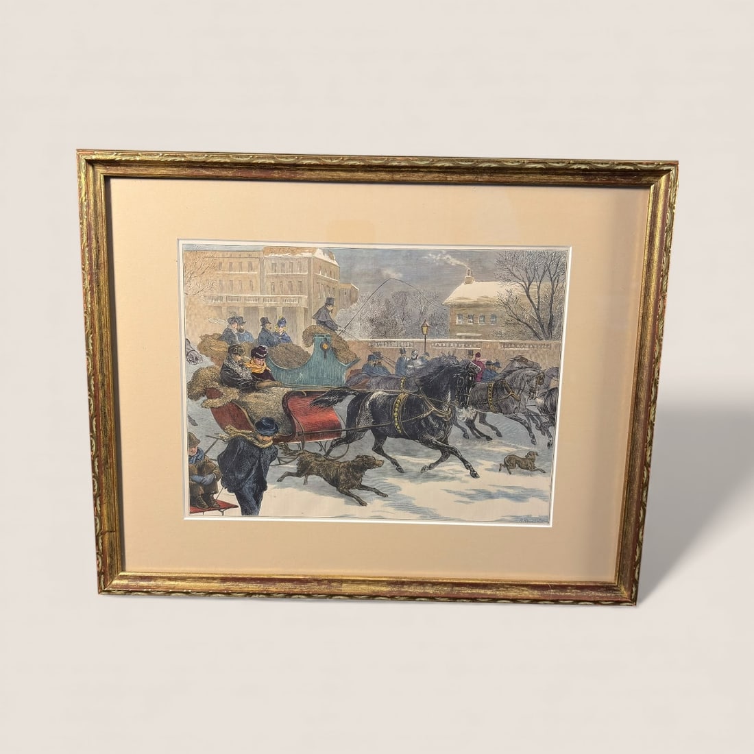 Hand Colored Etching People In Sleigh: A hand colored etching with people min sleigh, dogs, buildings. 18 x 14 frame size