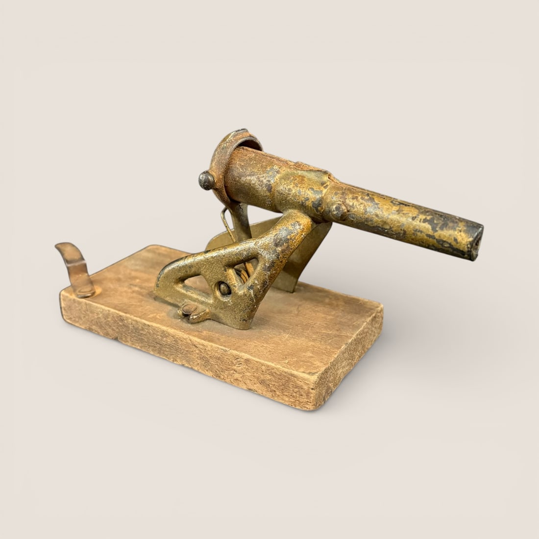 Folk Art Antique Toy Cannon: Unique Homemade Toy Cannon. 5 1/2 inches long. Iron with wood base. You pull spring loaded pan down and release to fire., Very cool To bid with us directly, please visit Ziebarths.com (18% buyers prem