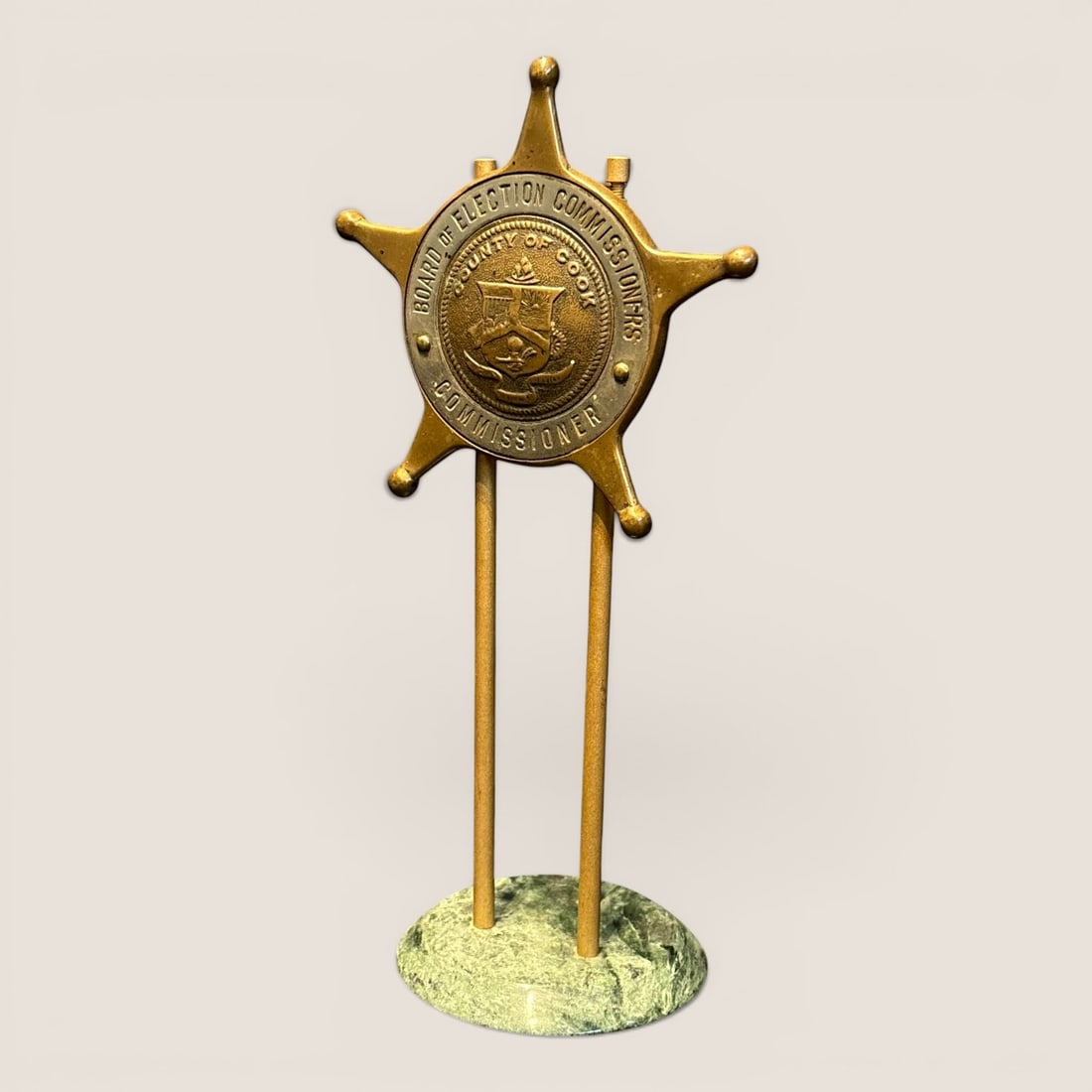 Vintage Cook County Board of Election Commissioners Commissioner Desk Badge Display on Marble Base: This official desk display features a six-pointed cast metal star badge with ball tips, signifying the position of Commissioner for the Cook County Board of Election Commissioners. The badge is constr