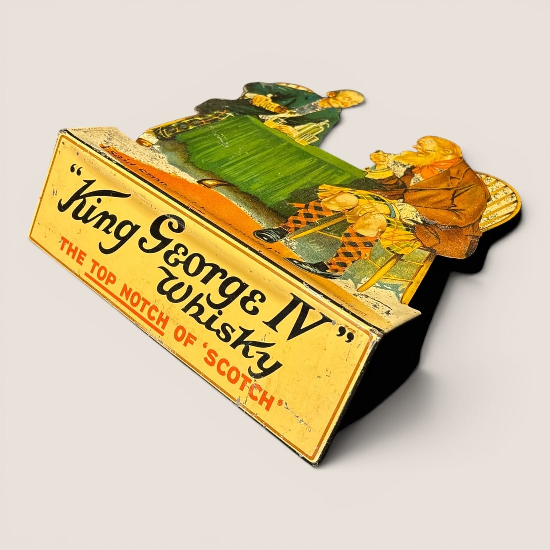 King George IV Scotch Whisky Die-Cut Tin Lithograph Advertising Stand by Lawson Wood, circa 1920s (1 of 2)