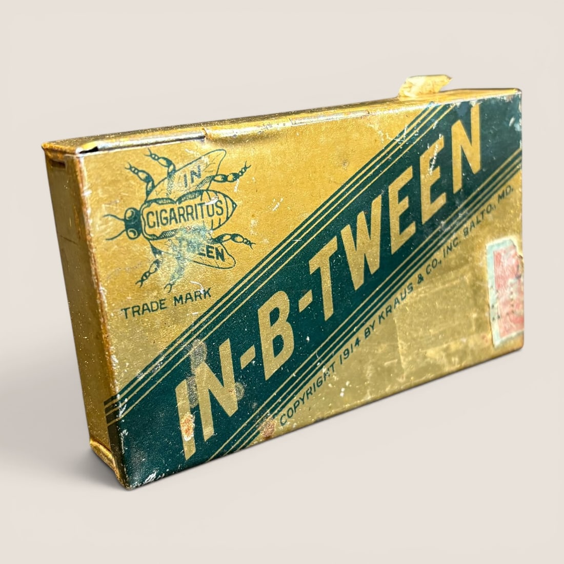 Antique Kraus and Co. In-BETween Cigarette Tobacco Tin: This is a lithographed metal advertising tin for In-B-Tween brand Cigarettes, produced by Kraus and Co., Inc. of Baltimore, Maryland. The rectangular tin features a gold-toned lithographed finish deco