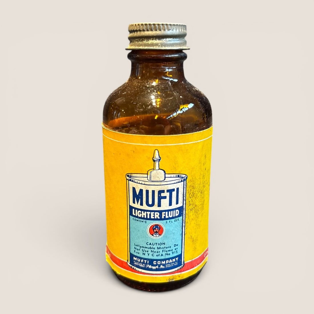 Vintage Mufti Lighter Fluid 3 Fluid Ounce Amber Glass Advertising Bottle (1 of 2)