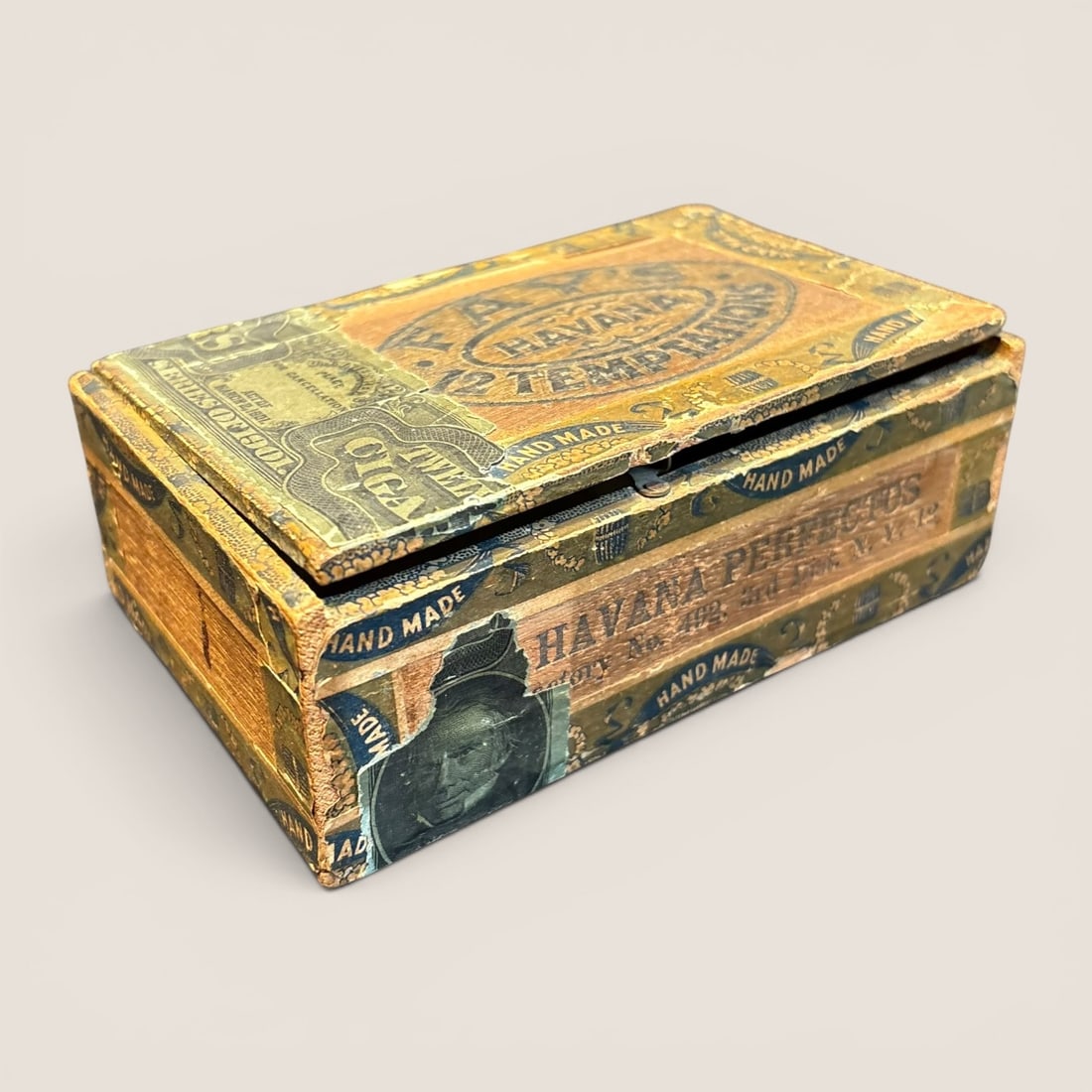 Antique Fay Lewis & Bros. Co. Fay's Twelve Temptations Wooden Cigar Box with 1901 Tax Stamp: This antique wooden cigar box was produced by Fay Lewis & Bros. Co. for Fay's Twelve Temptations cigars. The box is constructed of wood and is adorned with various chromolithograph paper labels. The i