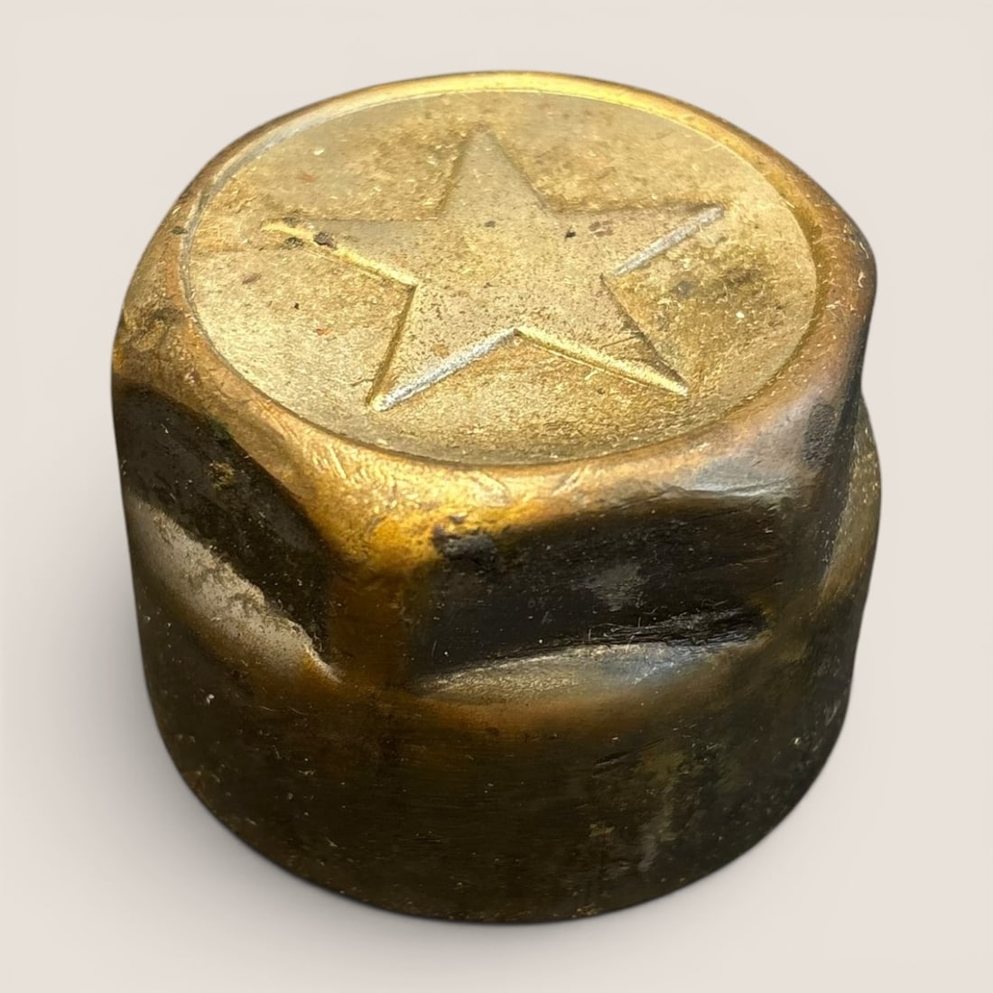Vintage Star Automobile Grease Cap by Durant Motors: This vintage automotive grease cap is attributed to the Star brand of automobiles produced by Durant Motors in the United States between 1922 and 1928. The component is cast from a copper alloy, typic