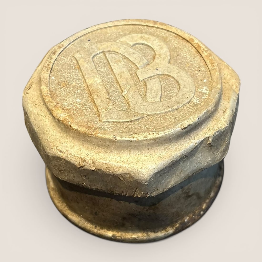Antique Dodge Brothers Motor Car Hub Grease Cap: This is an original Dodge Brothers motor car hub grease cap, produced approximately between 1914 and 1925. The component is cast from a non-ferrous metal, likely brass or bronze, and shows evidence