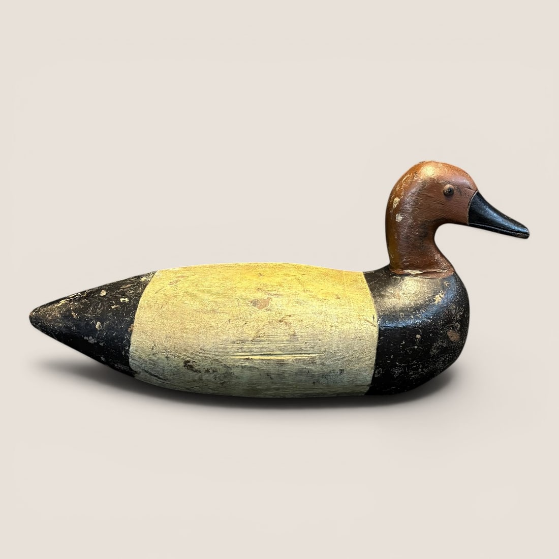 Early Wooden Red Headed Duck Decoy: Measures approx 16 inches in length. Good condition.We provide in-house shipping on all items in the auction. Bid directly at Bid.Ziebarths.com for a lower buyers premium (18%).