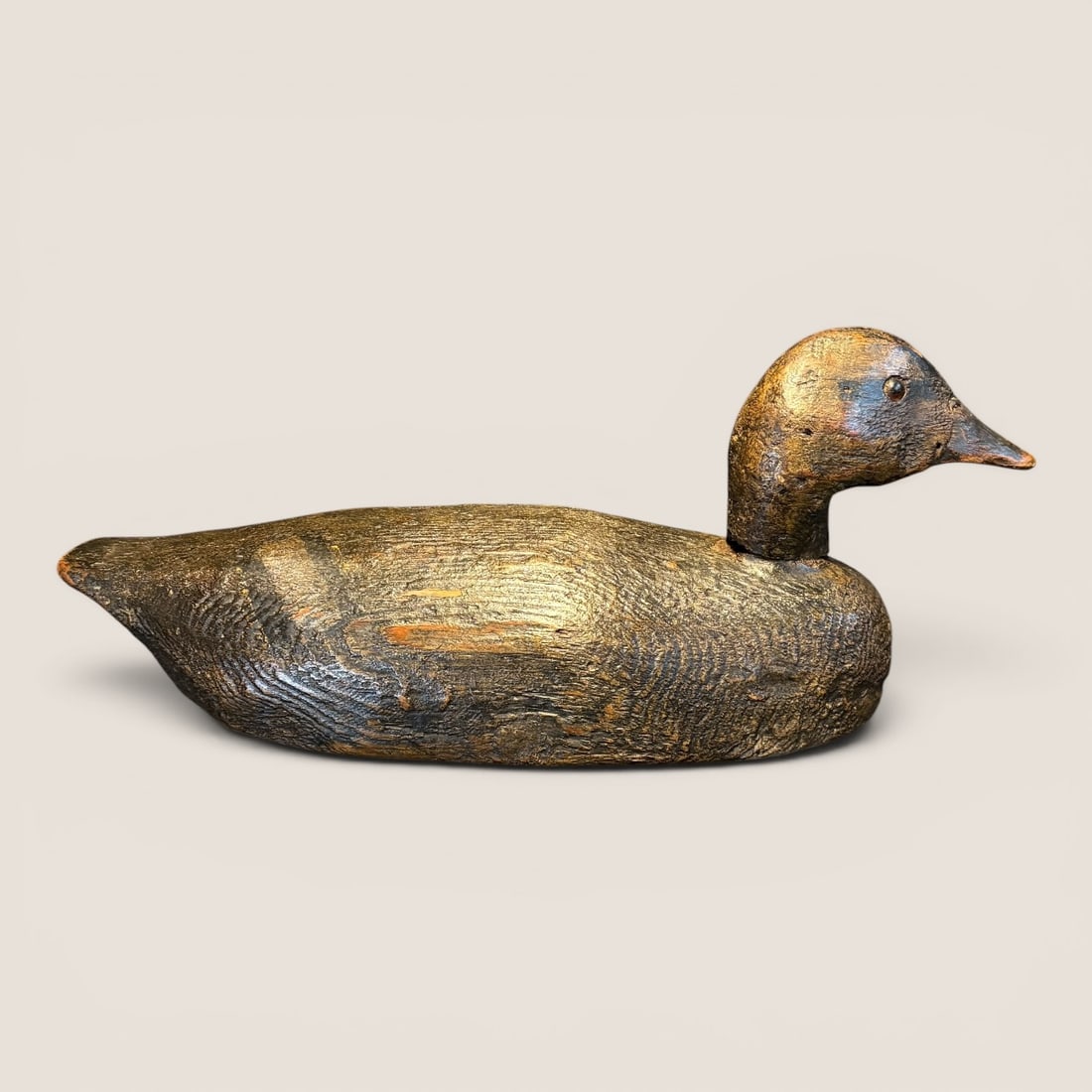 Early Wooden Brown Duck Decoy: Carved of wood, measures approx 15 inches in length.We provide in-house shipping on all items in the auction. Bid directly at Bid.Ziebarths.com for a lower buyers premium (18%).