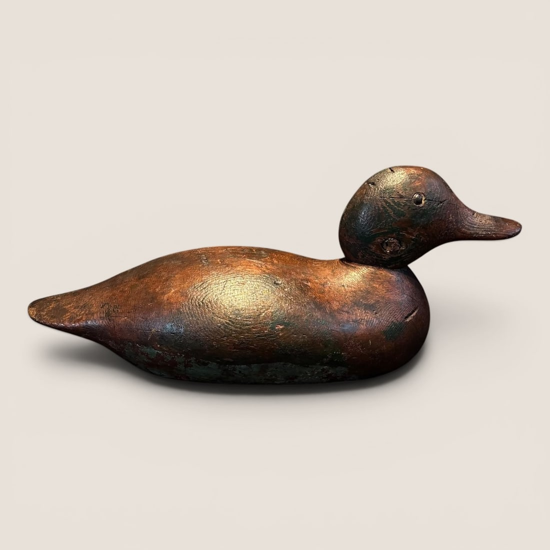 Wooden Duck Decoy: Tacked metal eyes, measures approx 14 inches in length.We provide in-house shipping on all items in the auction. Bid directly at Bid.Ziebarths.com for a lower buyers premium (18%).