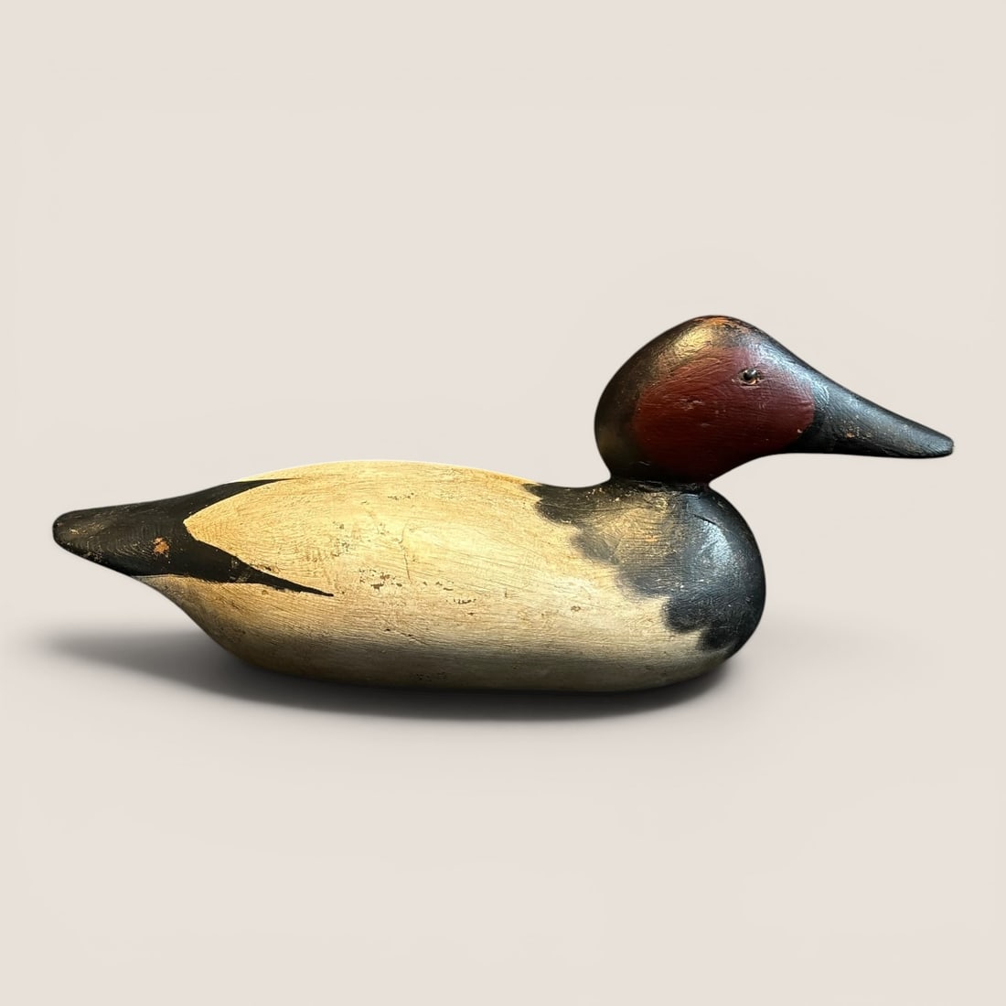 Excellent Mason Decoy Factory Decoy: An excellent carved wooden Mason Decoy Factory decoy, measuring approx 15 inches in length.We provide in-house shipping on all items in the auction. Bid directly at Bid.Ziebarths.com for a lower
