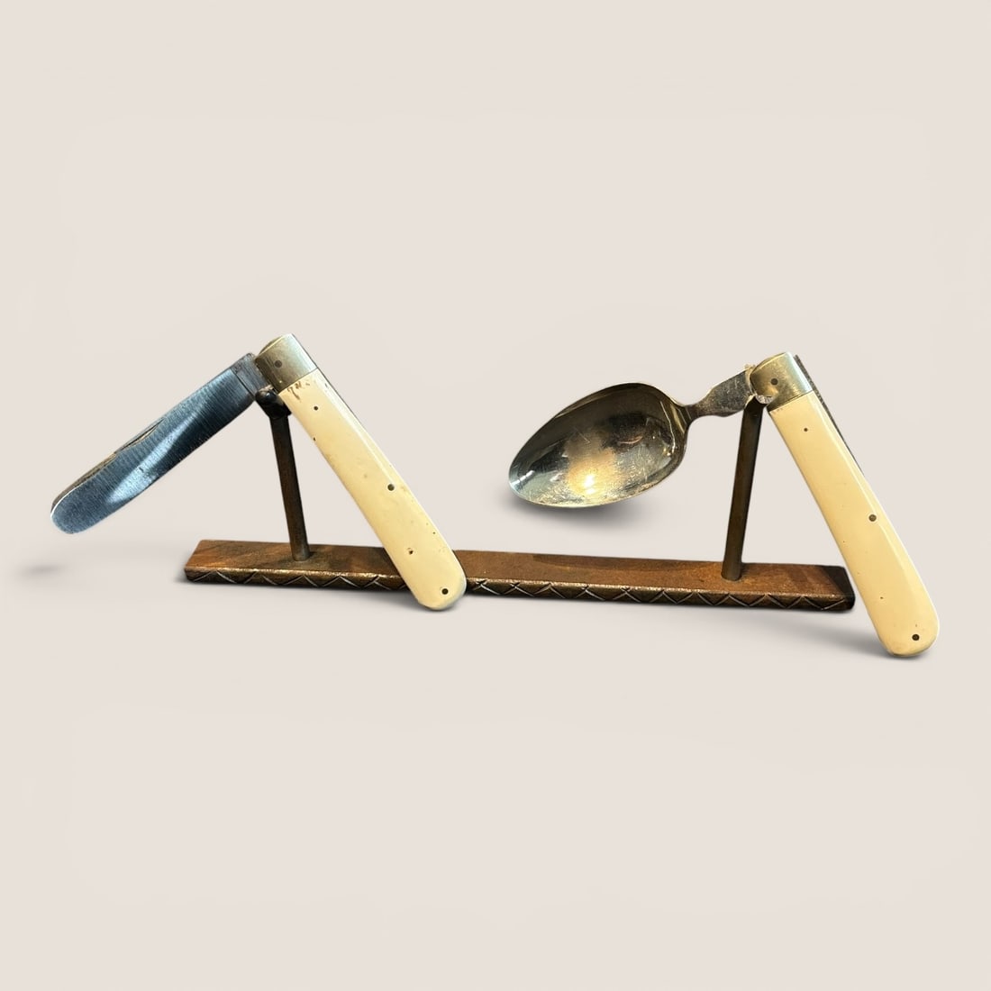Travelers Folding Knife & Spoon Set: Two pieces, knife and spoon, Each folding.We provide in-house shipping on all items in the auction. Bid directly at Bid.Ziebarths.com for a lower buyers premium (18%).
