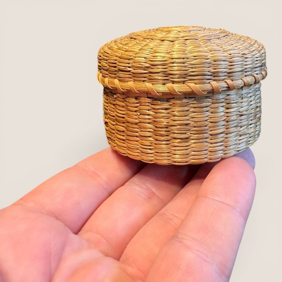 Miniature Native American Basket: Early 20th century, lidded, measuring approx 3 x 2 inches.We provide in-house shipping on all items in the auction. Bid directly at Bid.Ziebarths.com for a lower buyers premium (18%).