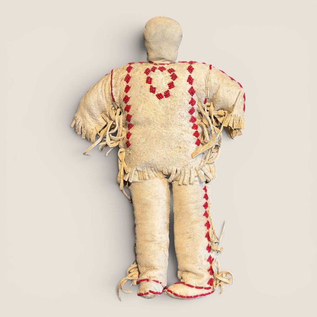 Large Beaded Sioux Doll: An outstanding early Plains male doll, measuring 13 inches tall. We provide in-house shipping on all items in the auction. Bid directly at Bid.Ziebarths.com for a lower buyers premium (18%).