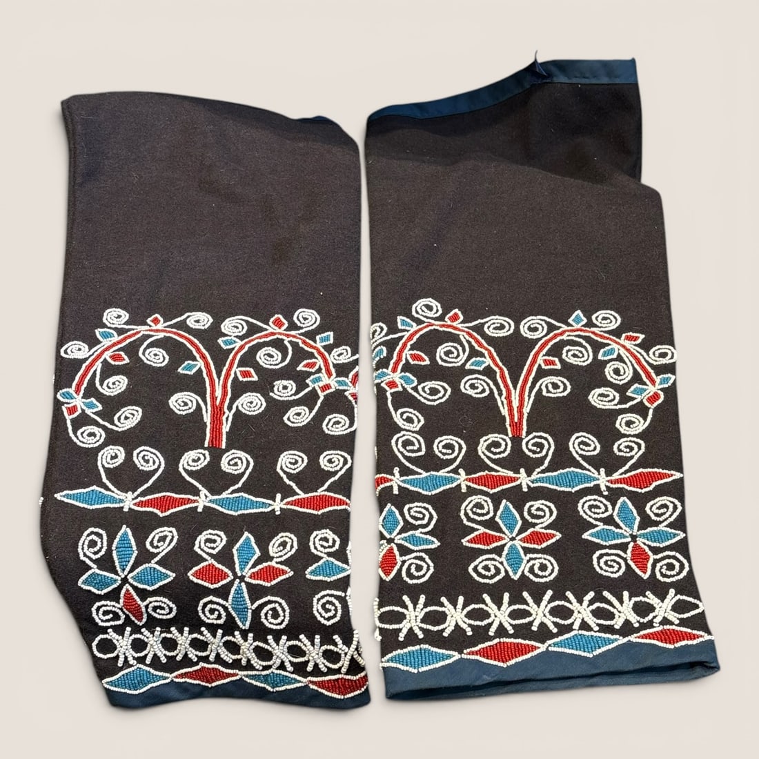 Exceptional Pair of Seneca Beaded Leggings: Bead on trade cloth, excellent condition.We provide in-house shipping on all items in the auction. Bid directly at Bid.Ziebarths.com for a lower buyers premium (18%).