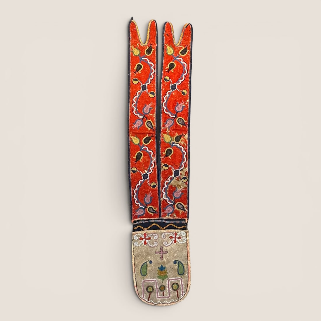 19th Century Bandolier Bag/Shot Pouch: Measuring approx 32 inches in length x 6.5 inches across at the bag. Early trade beads, circa 1860s. A bright red trade cloth to the strap makes this bag exceptionally stunning. Some loss, and age