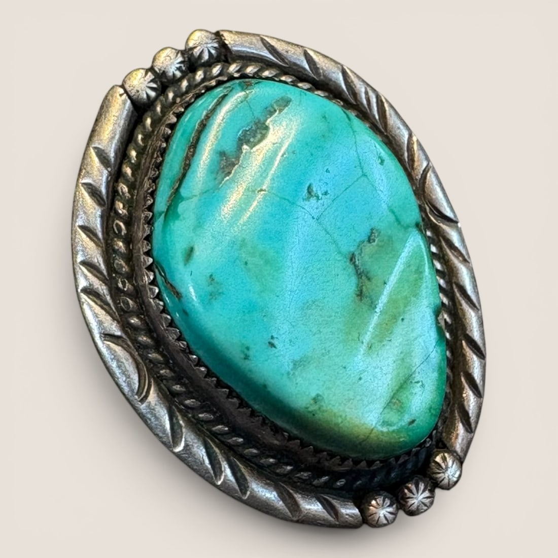 Early Navajo Ring Marked ELE: Marked ELE and sterling. Measures approx 3/4 inches in diameter.We provide in-house shipping on all items in the auction. Bid directly at Bid.Ziebarths.com for a lower buyers premium (18%).