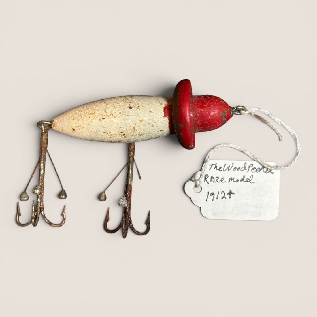 Vintage Woodpecker Fishing Lure: Circa 1912 + " Woodpecker " fishing lureWe provide in-house shipping on all items in the auction. Bid directly at Bid.Ziebarths.com for a lower buyers premium (18%).