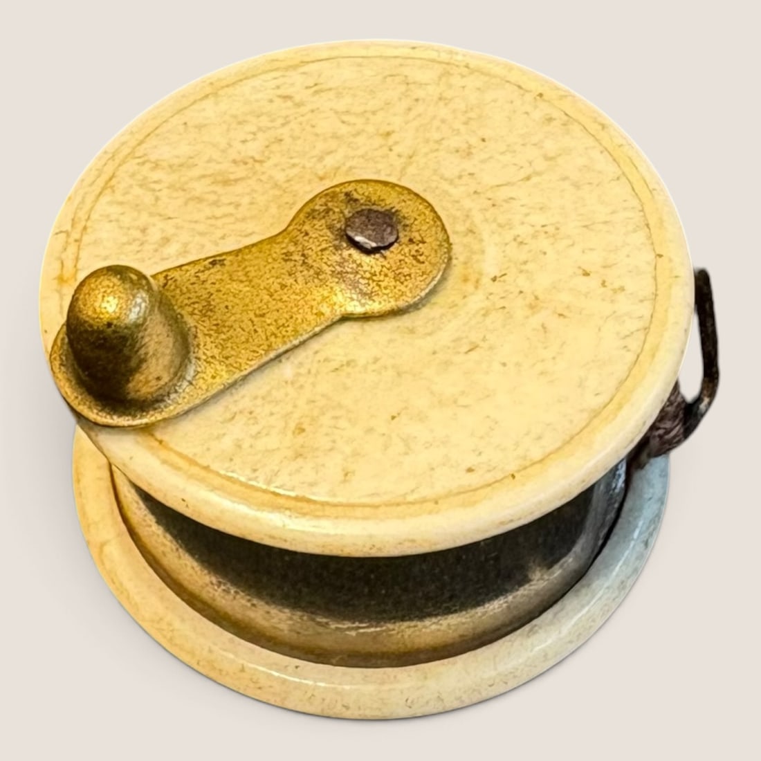Rare Miniature Tape Measure In Shape Of A Fishing Reel: A rare miniature tape measure in the shape of a fishing reel bone and brass 1 inch excellent Bid directly at Bid.Ziebarths.com for a lower buyers premium (18%). We offer in-house shipping on all
