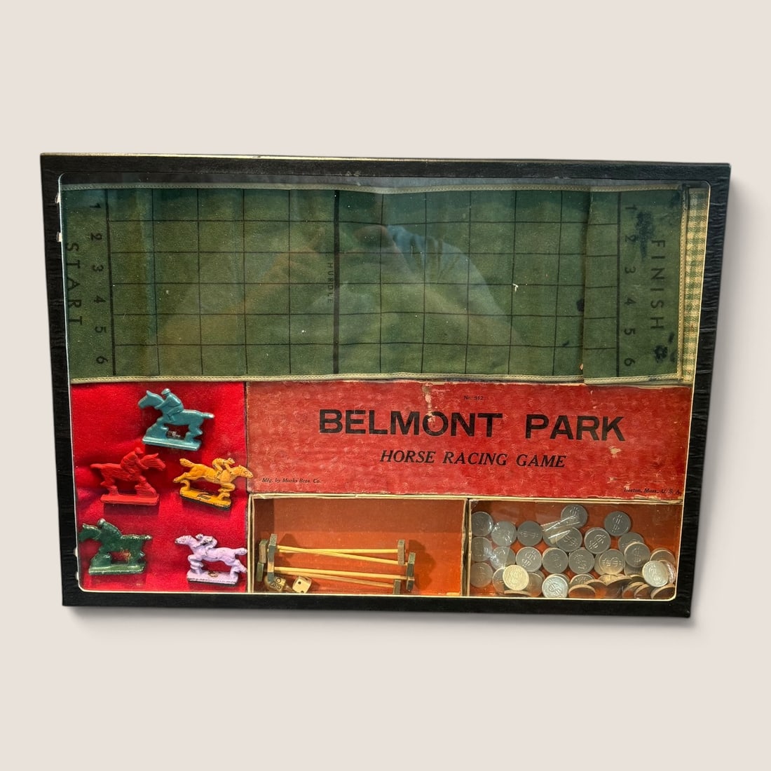 1920s-1930s Belmont Park Horse Racing Game: Early Belmont Park horse racing game complete with original cast iron horses-hurdles-coins-race track-and box. Box has wear Bid directly at Bid.Ziebarths.com for a lower buyers premium (18%). We