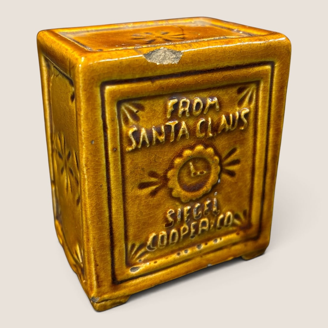 Vintage Pottery From Santa Claus Safe Penny Bank: A pottery antique penny bank form of a safe From Santa Claus embossed on side 3 x 3 1/2 x 2 small line and nick at top Bid directly at Bid.Ziebarths.com for a lower buyers premium (18%). We offer in-h