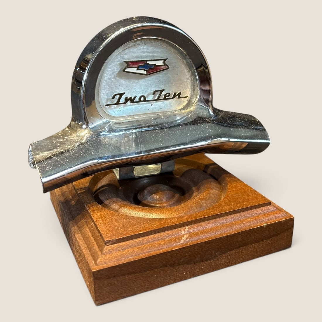 1957 Chevrolet Two-Ten Steering Wheel Horn Cap Ornament: Nice 1957 Chevrolet Two-Ten steering wheel horn cap ornament mounted on wood block excellent Bid directly at Bid.Ziebarths.com for a lower buyers premium (18%). We offer in-house shipping on all items