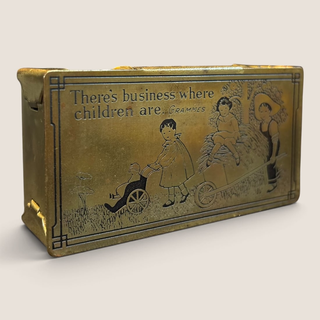 Antique Childrens Stamp Box Great Graphics: Late 1800s to early 1900s brass stamp box great graphics given to customers of L.F. Grammes Co. 3 1/2 x 1 3/4 very nice Bid directly at Bid.Ziebarths.com for a lower buyers premium (18%). We offer in-