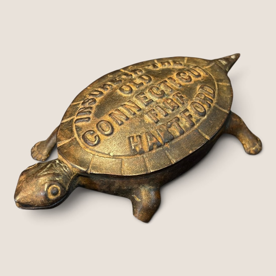 Antique Cast Iron Advertising Turtle Match Safe Or Trinket Holder: Antique cast iron turtle advertising Insure In The Old Connecticut Fire Hartford 5 1/2 inch excellent Bid directly at Bid.Ziebarths.com for a lower buyers premium (18%). We offer in-house shipping on 