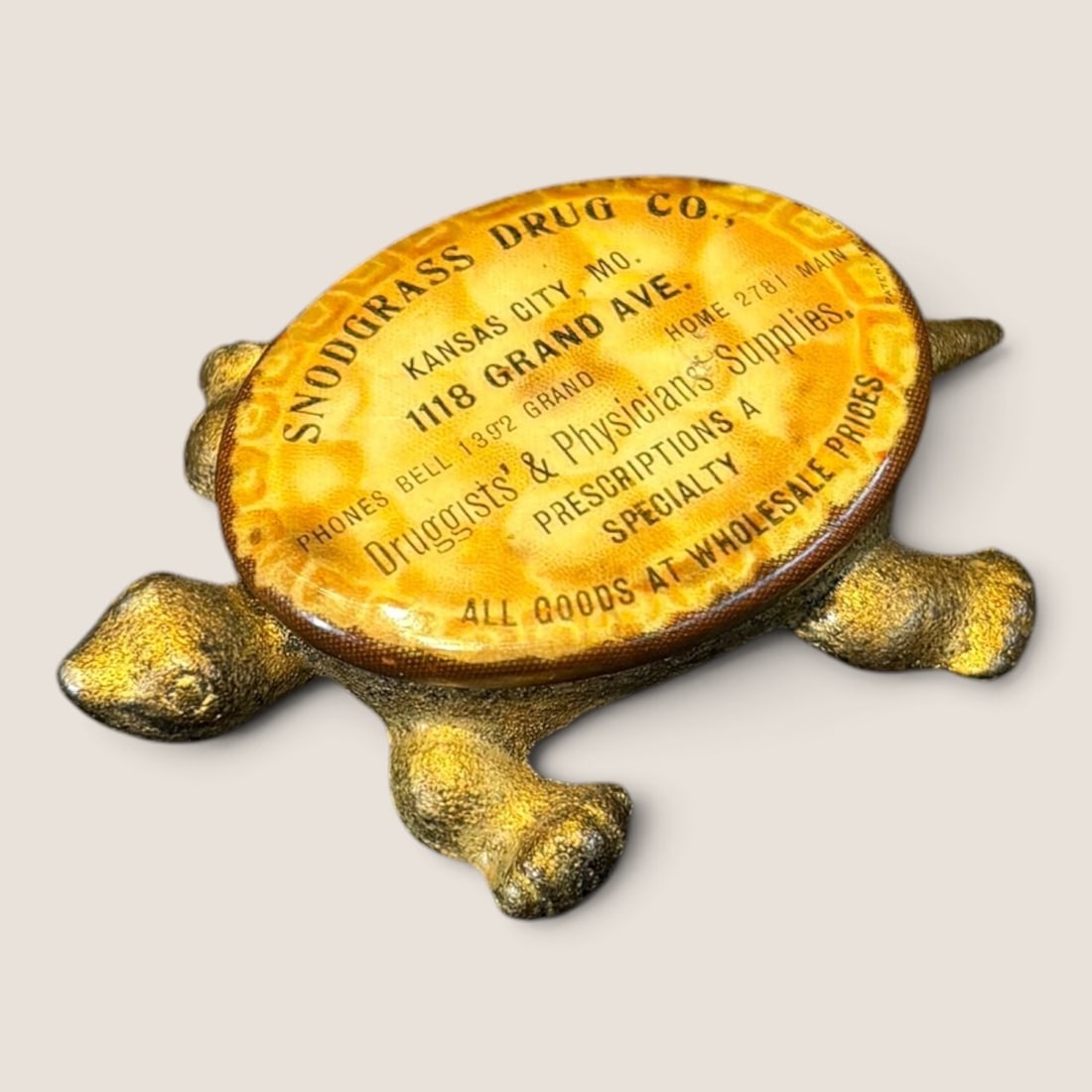 Early 1900s Advertising Cast Iron Turtle With Celluloid Advertising Top: Early cast iron advertising turtle with celluloid advertising top Snodgrass Drug Co. Kansas City Mo. 2 1/4 inch long Bid directly at Bid.Ziebarths.com for a lower buyers premium (18%). We offer in-hou