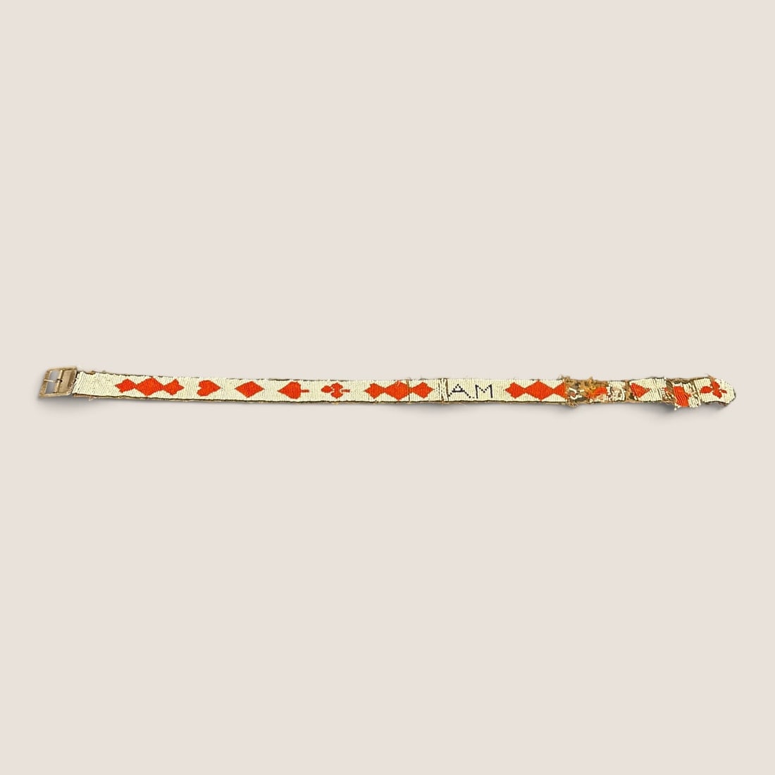 Antique Hand Beaded Folk Art Belt with Playing Card Suit Motif: This antique hand-beaded folk art belt is constructed with glass seed beads hand-sewn onto a dark brown fabric ribbon backing. The design features a repeating series of red playing card suit motifs, i