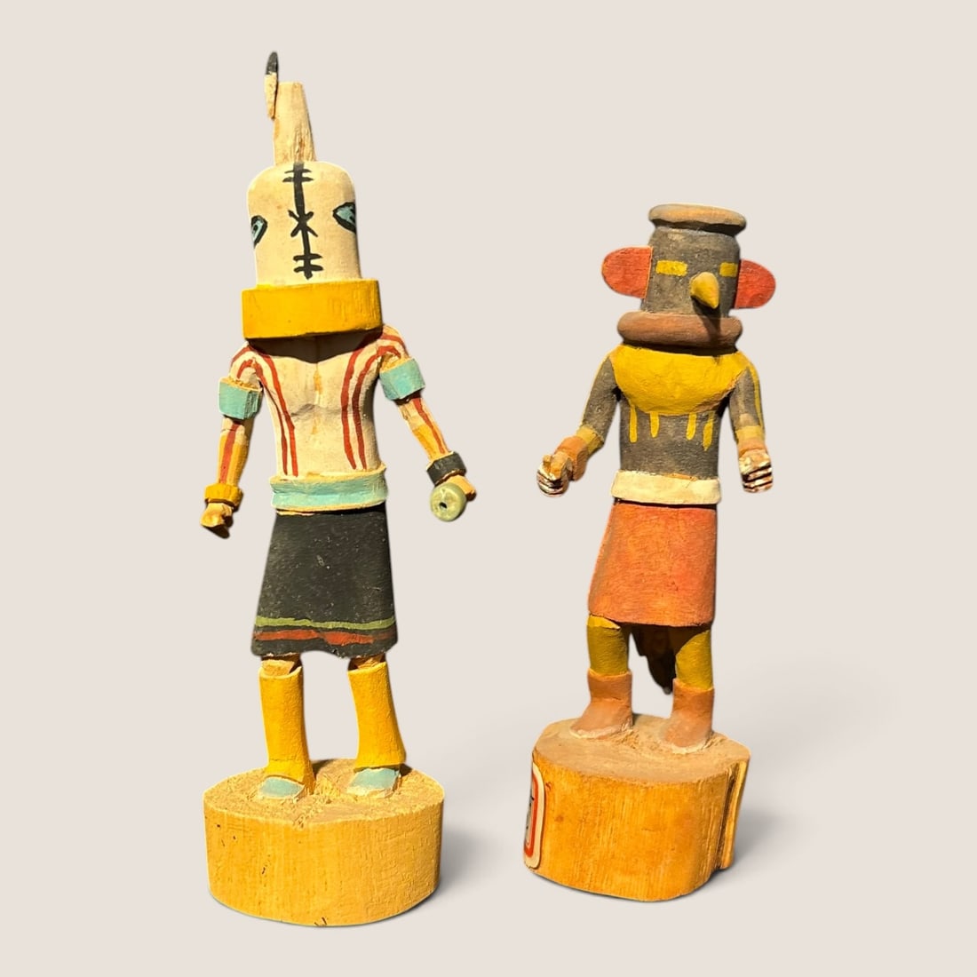 Pair (2) Miniature Kachina Dolls: One with a tag reading RED SKIRT RUNNER, excellent condition. Measuring approx 4.5 x 4 inches.We offer effecient & affordable in-house shipping on all items in this auction. Bid directly at