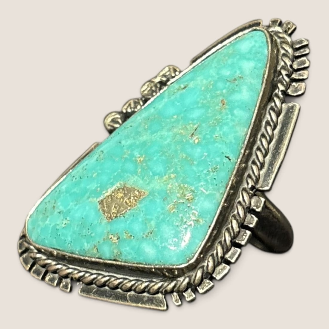 Large Navajo Sterling & Turquoise Ring (Gilbert Nez): Signed Gilbert Nez and marked sterling. The stone measuring approx 1.5 x .75 inches.We offer effecient & affordable in-house shipping on all items in this auction. Bid directly at Bid.Ziebarths.com