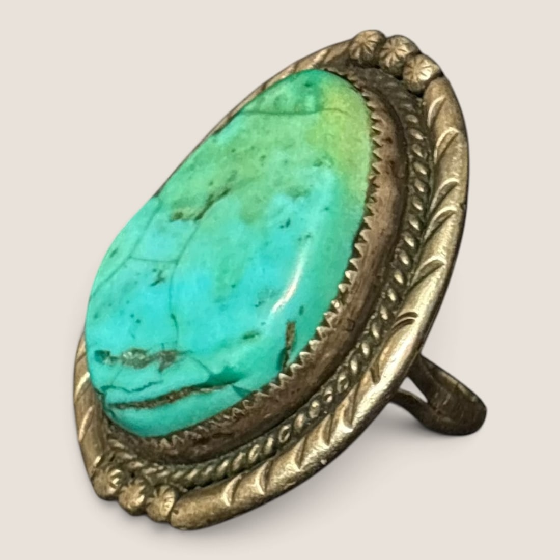 Navajo Sterling & Turquoise Ring (ELE): Signed ELE and marked sterling, stone measuring approx 1 x .75 inches.We offer effecient & affordable in-house shipping on all items in this auction. Bid directly at Bid.Ziebarths.com for our lowest
