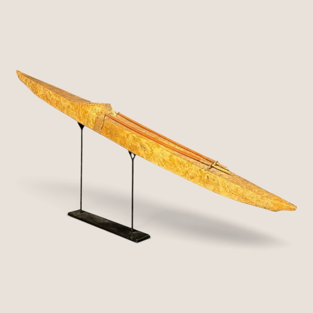 Large Inuit Skin-Covered Model Kayak with Hunting Implements: A finely constructed Inuit model kayak, likely dating from the early 20th century and possibly originating in the Western Canadian Arctic. The long, narrow vessel is formed from a lightweight wooden